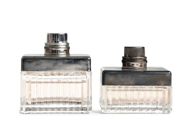 Photo of Different perfume bottles on white background