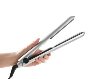 Photo of Woman holding hair iron against white background, closeup