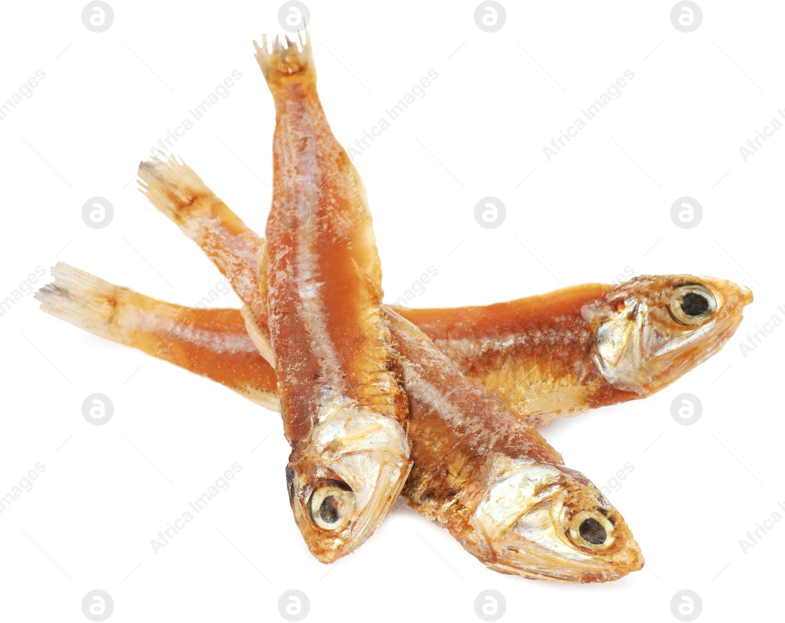 Photo of Delicious dried salted anchovies on white background