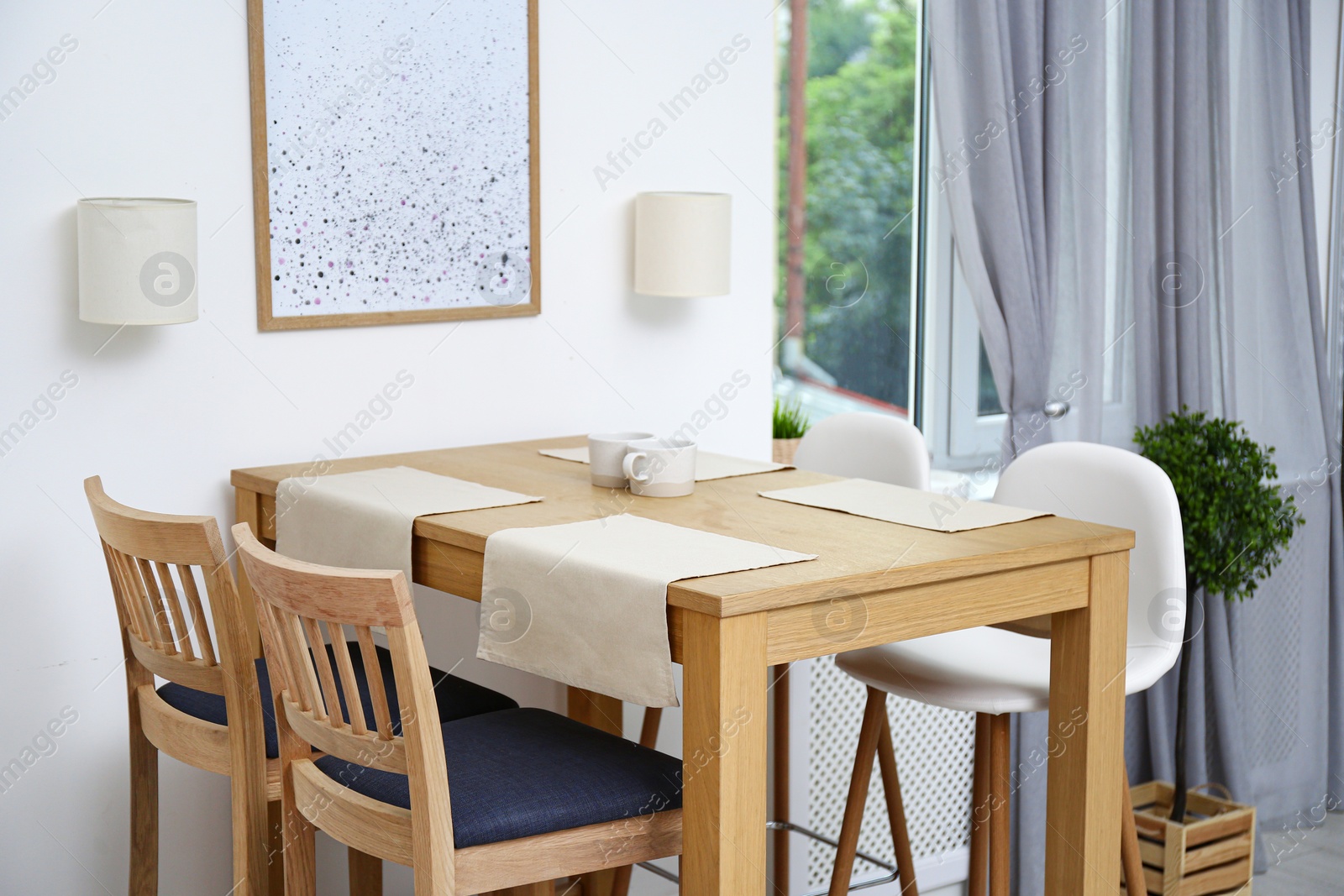 Photo of Modern room interior with wooden dining table