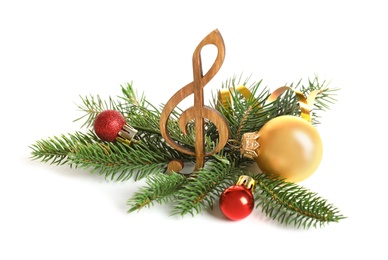 Wooden treble clef and decorations on white background. Christmas music concept