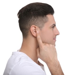 Photo of Man pointing at his ear on white background
