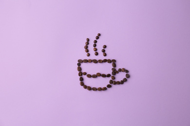 Photo of Cup made of coffee beans on lilac background, flat lay