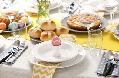 Photo of Festive Easter table setting with traditional meal