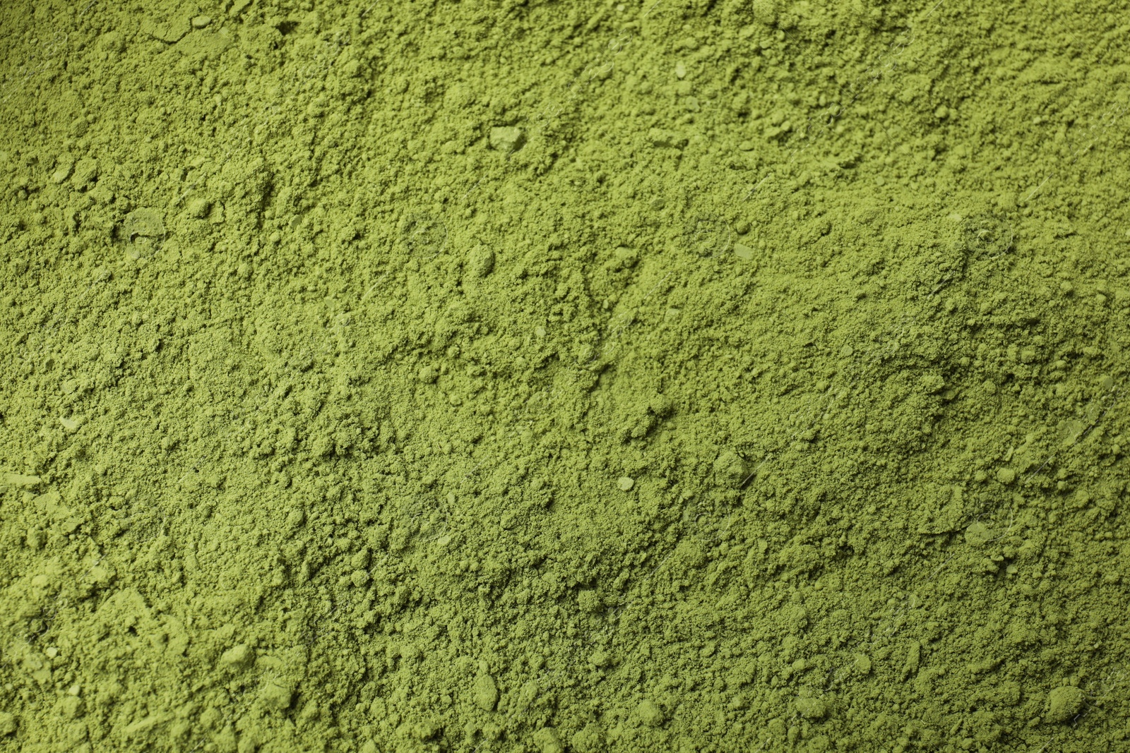 Photo of Green matcha powder as background, top view