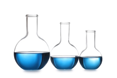 Photo of Florence flasks with blue liquid isolated on white. Laboratory glassware