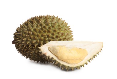 Cut and whole ripe durians on white background