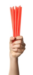 Woman holding bunch of plastic straws on white background, closeup