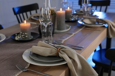 Photo of Festive table setting with beautiful tableware and decor indoors