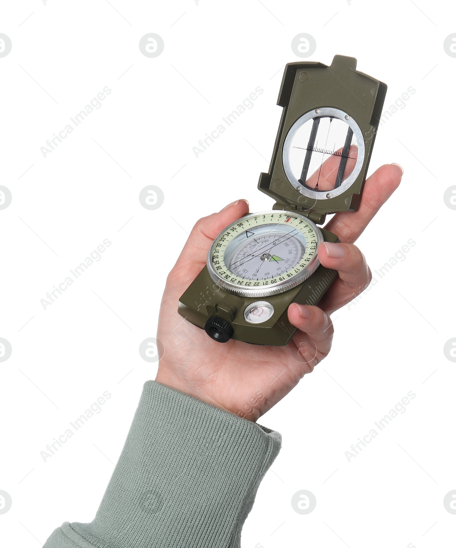 Photo of Woman holding compass on white background, closeup