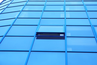 Modern office building with tinted windows. Urban architecture