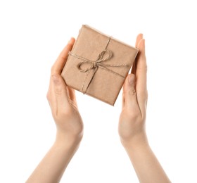 Photo of Woman holding parcel wrapped in kraft paper on white background, closeup