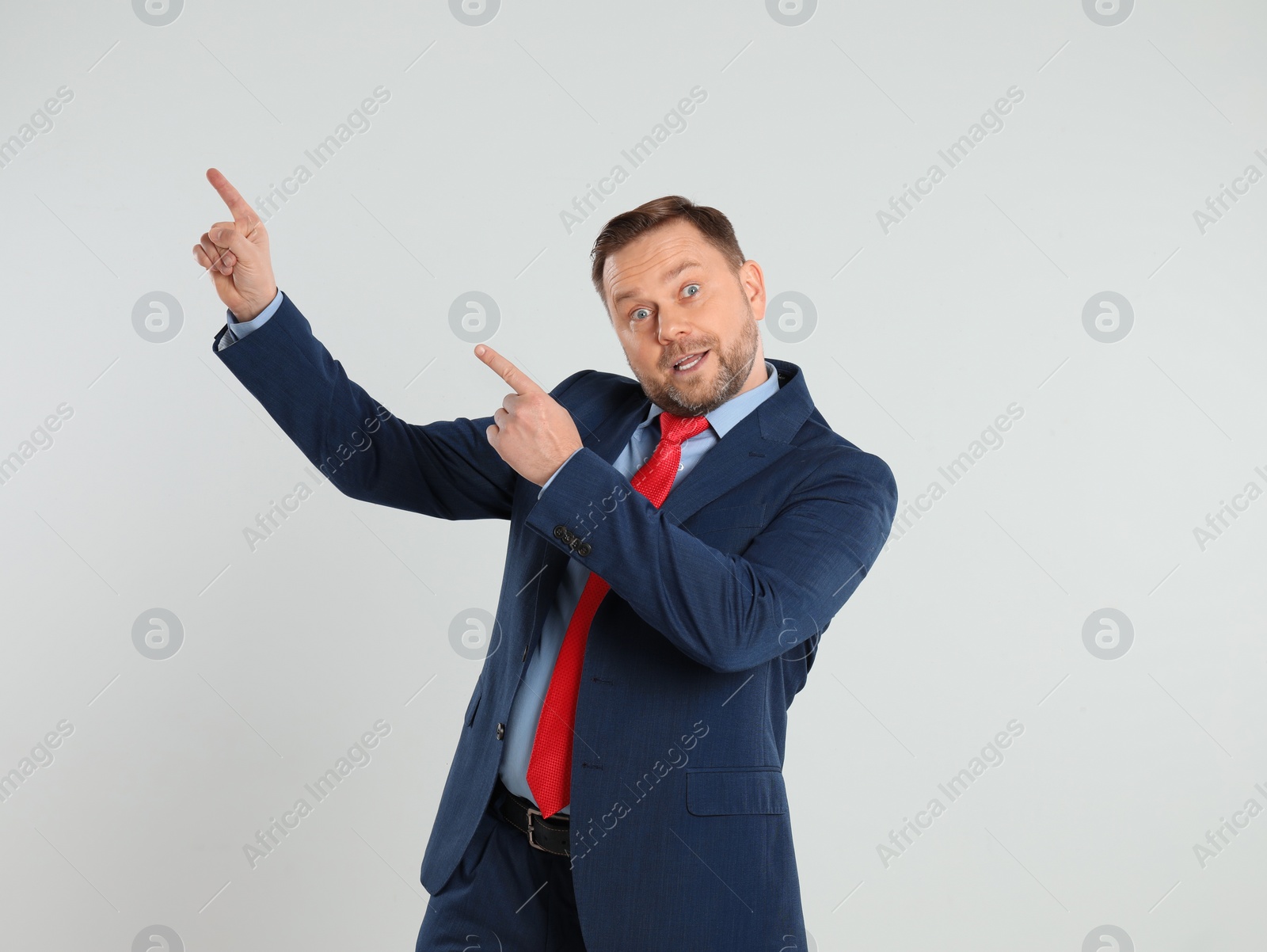 Photo of Portrait of emotional mature man on light grey background