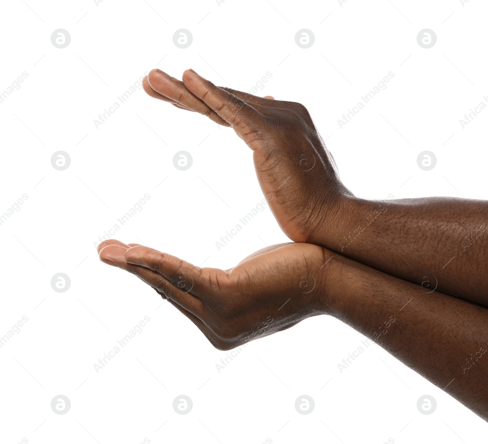 Photo of African-American man holding something in hands on white background, closeup