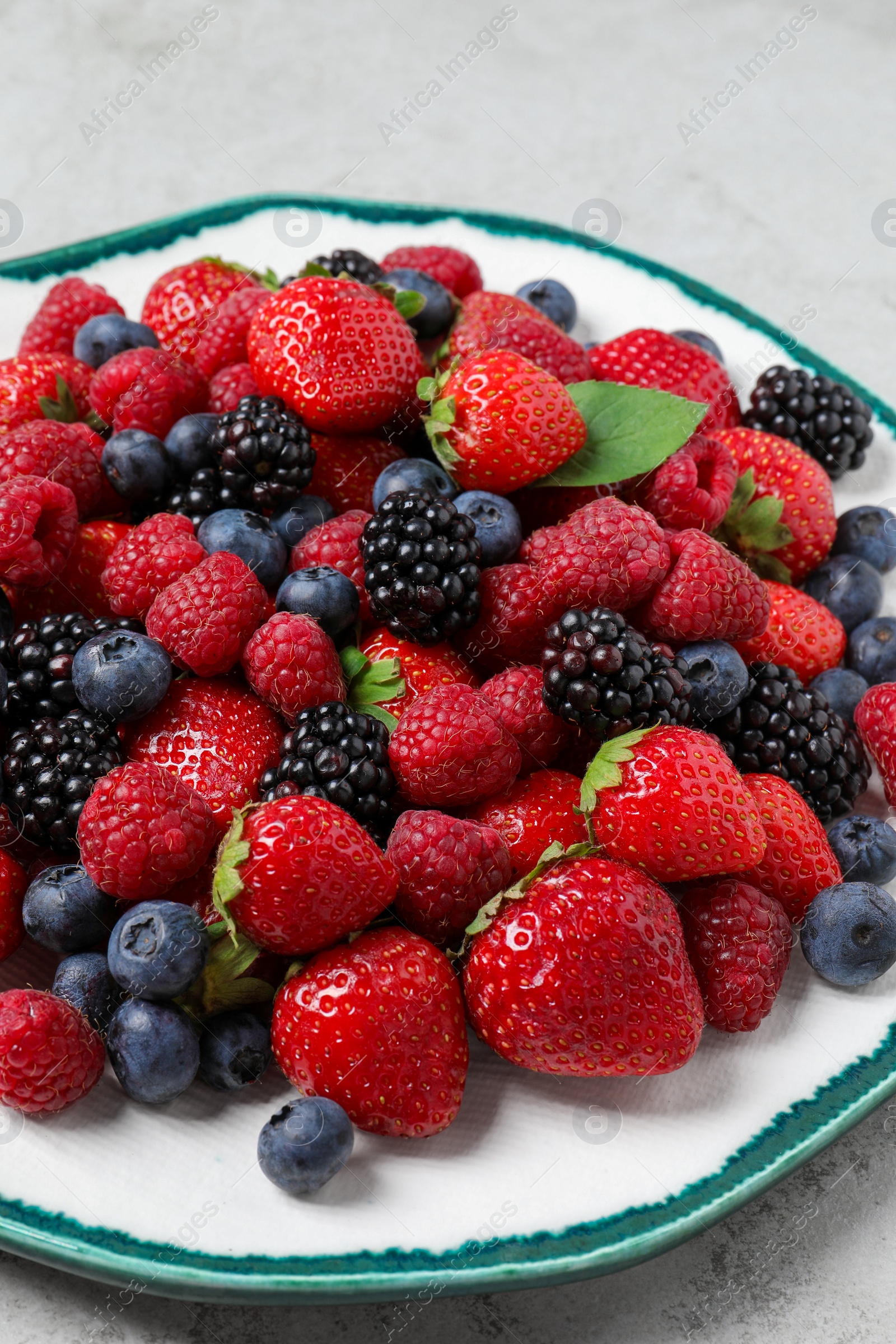 Photo of Different fresh ripe berries on table, closeup