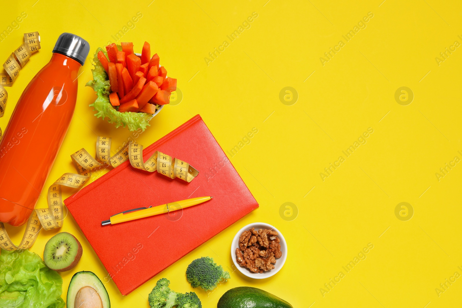 Photo of Weight loss concept. Flat lay composition with notebook, thermo bottle, measuring tape and different products on yellow background, space for text