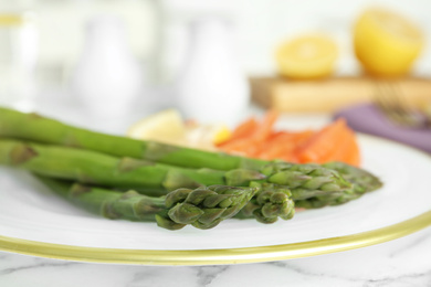 Closeup view of tasty asparagus on plate