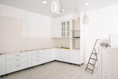Stylish kitchen interior with newly installed furniture