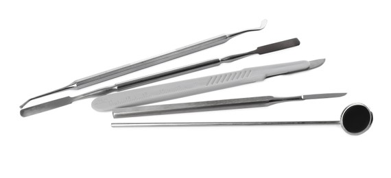 Set of different dentist's tools on white background