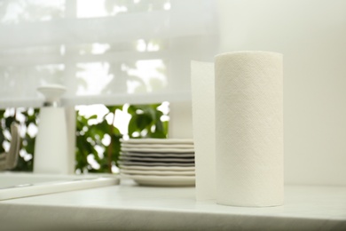 Photo of Paper towels on white marble table in kitchen, space for text