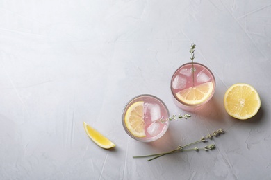 Photo of Flat lay composition with natural lemonade on light background