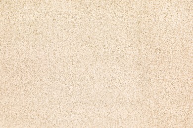 Photo of Texture of beige plaster wall as background