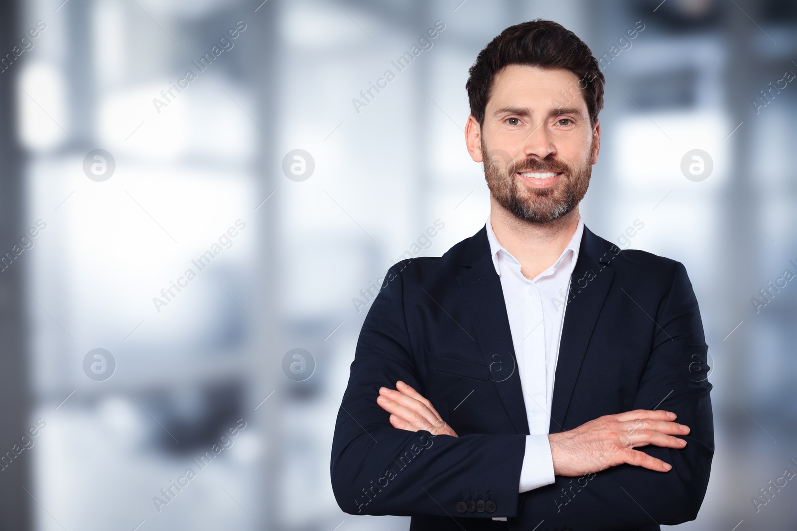 Image of Handsome real estate agent in office, space for text