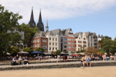 Cologne, Germany - August 28, 2022: Blurred view of beautiful city street and buildings