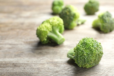 Fresh green broccoli on wooden table, closeup