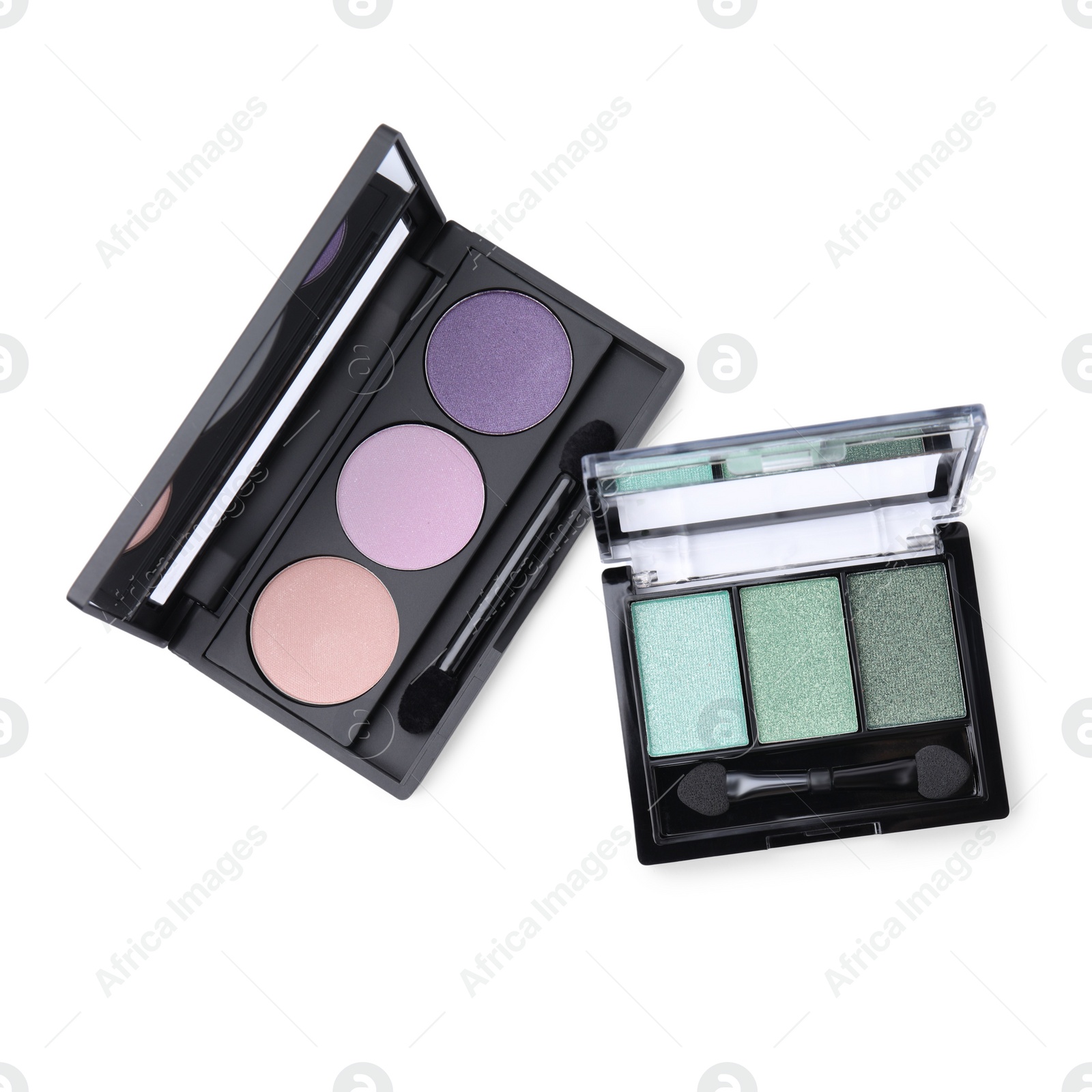 Photo of Beautiful eye shadow palettes with brushes isolated on white, top view