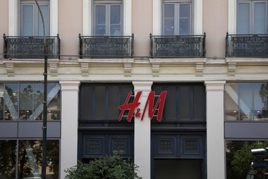 Photo of Athens, Greece - May 25, 2022: H&M fashion store logo on building outdoors