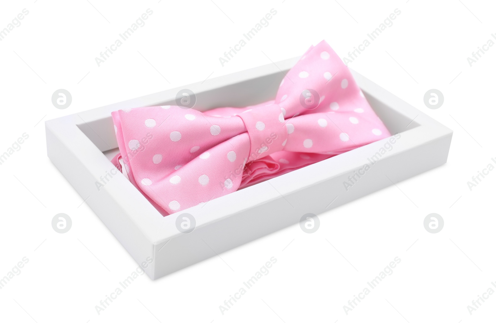 Photo of Stylish pink bow tie with polka dot pattern on white background
