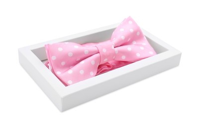 Stylish pink bow tie with polka dot pattern on white background