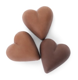 Photo of Tasty heart shaped chocolate candies on white background, top view. Valentine's day celebration