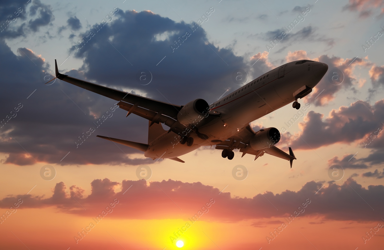 Image of Plane in sky during sunset, low angle view