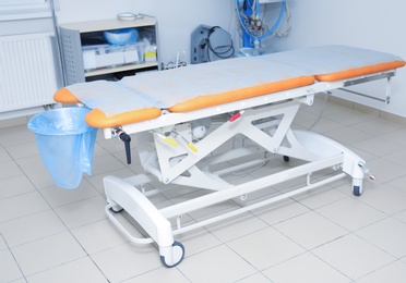 Photo of Operating table in surgery room of modern clinic
