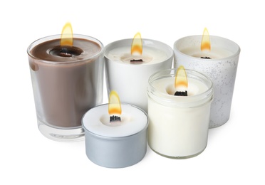 Photo of Aromatic candles with wooden wicks on white background