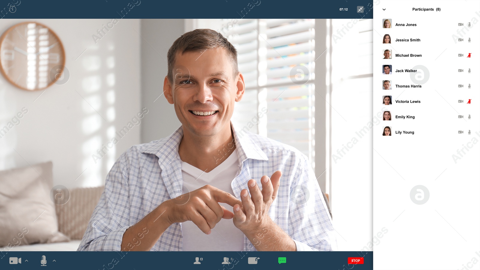 Image of Man communicating with coworkers from home using video chat, view through camera
