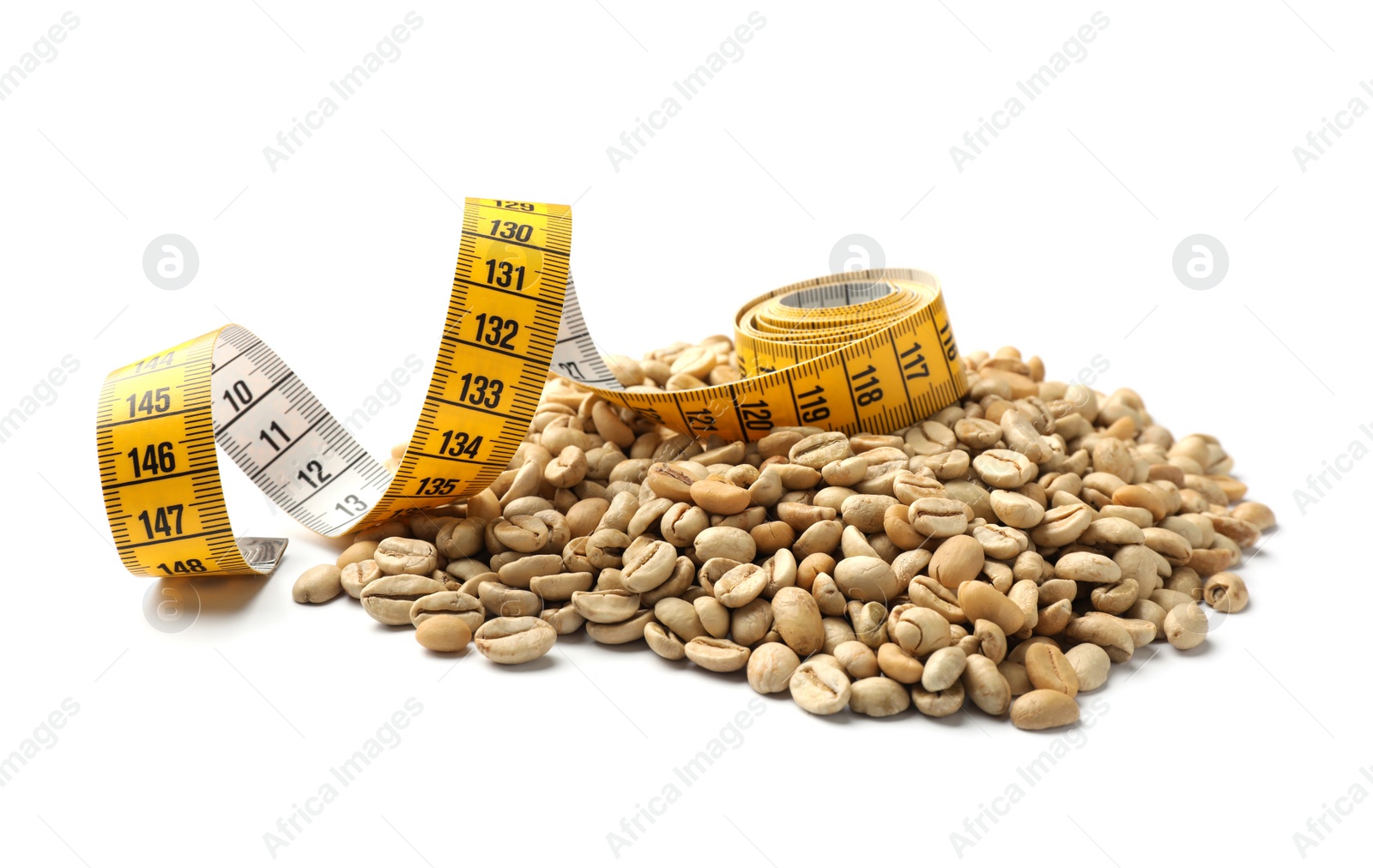 Photo of Pile of green coffee beans and measuring tape on white background