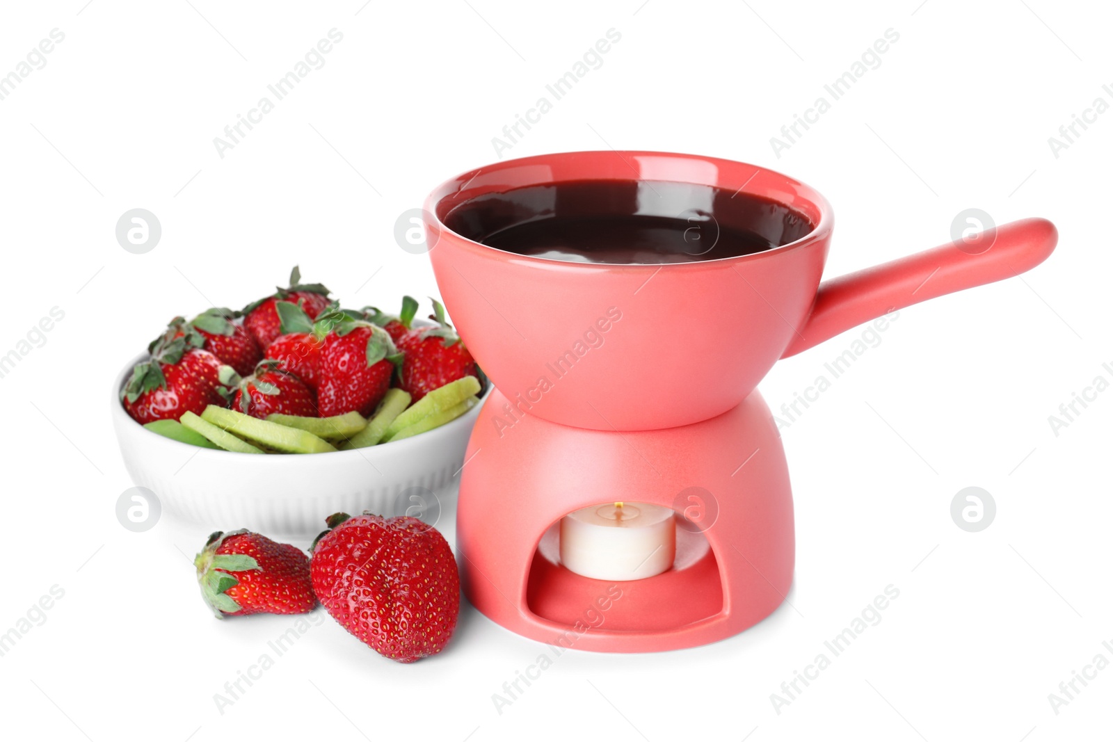 Photo of Fondue pot with chocolate, berries and fruits isolated on white