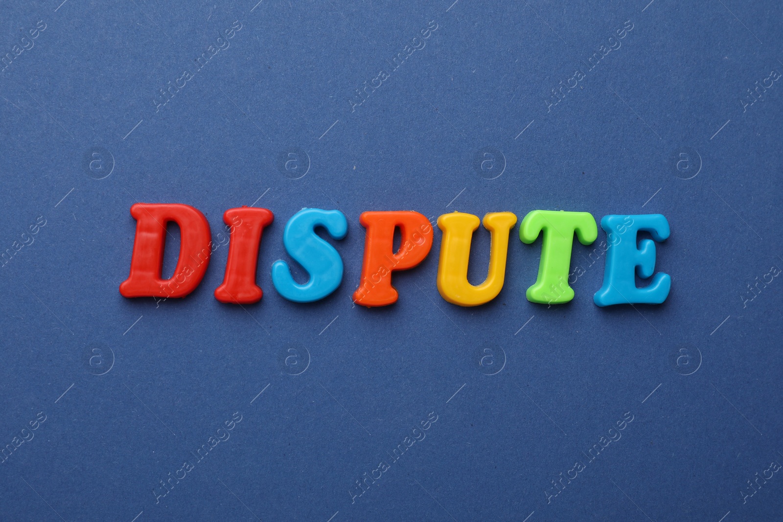 Photo of Word Dispute made of colorful letters on blue background, flat lay