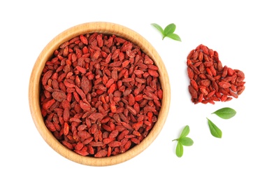 Composition with bowl, leaves and goji berries on white background, top view