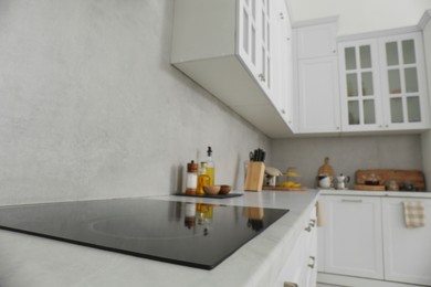 Modern inductive cooktop in kitchen. Interior design