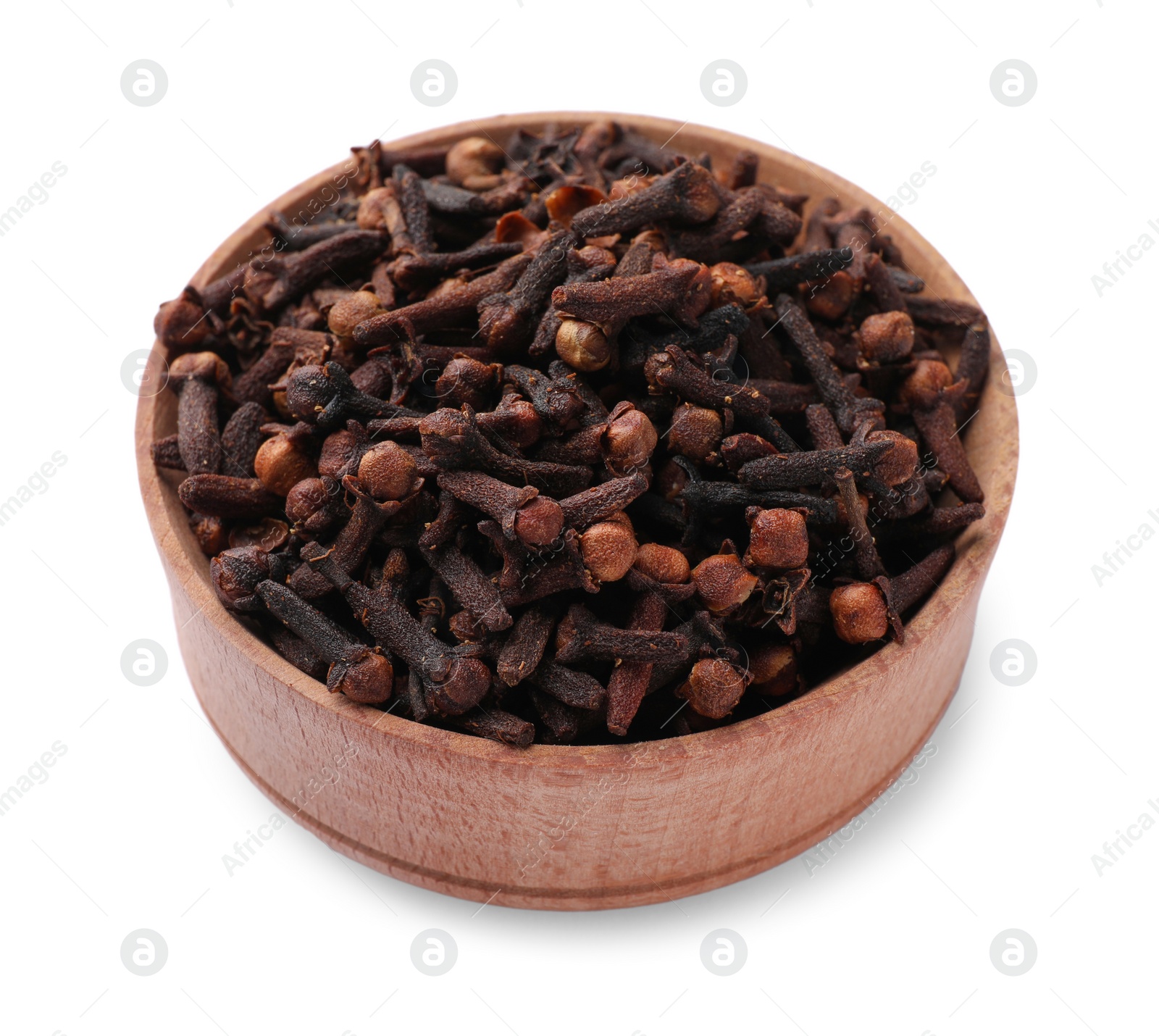 Photo of Aromatic dry cloves in wooden bowl isolated on white