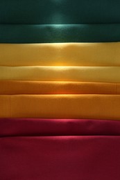 Photo of Different colorful napkins as background, top view