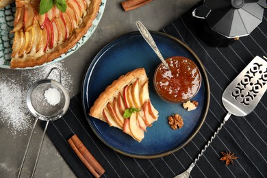 Delicious apple pie served on grey table, flat lay