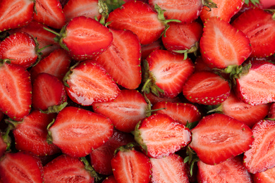 Photo of Tasty ripe strawberries as background, top view