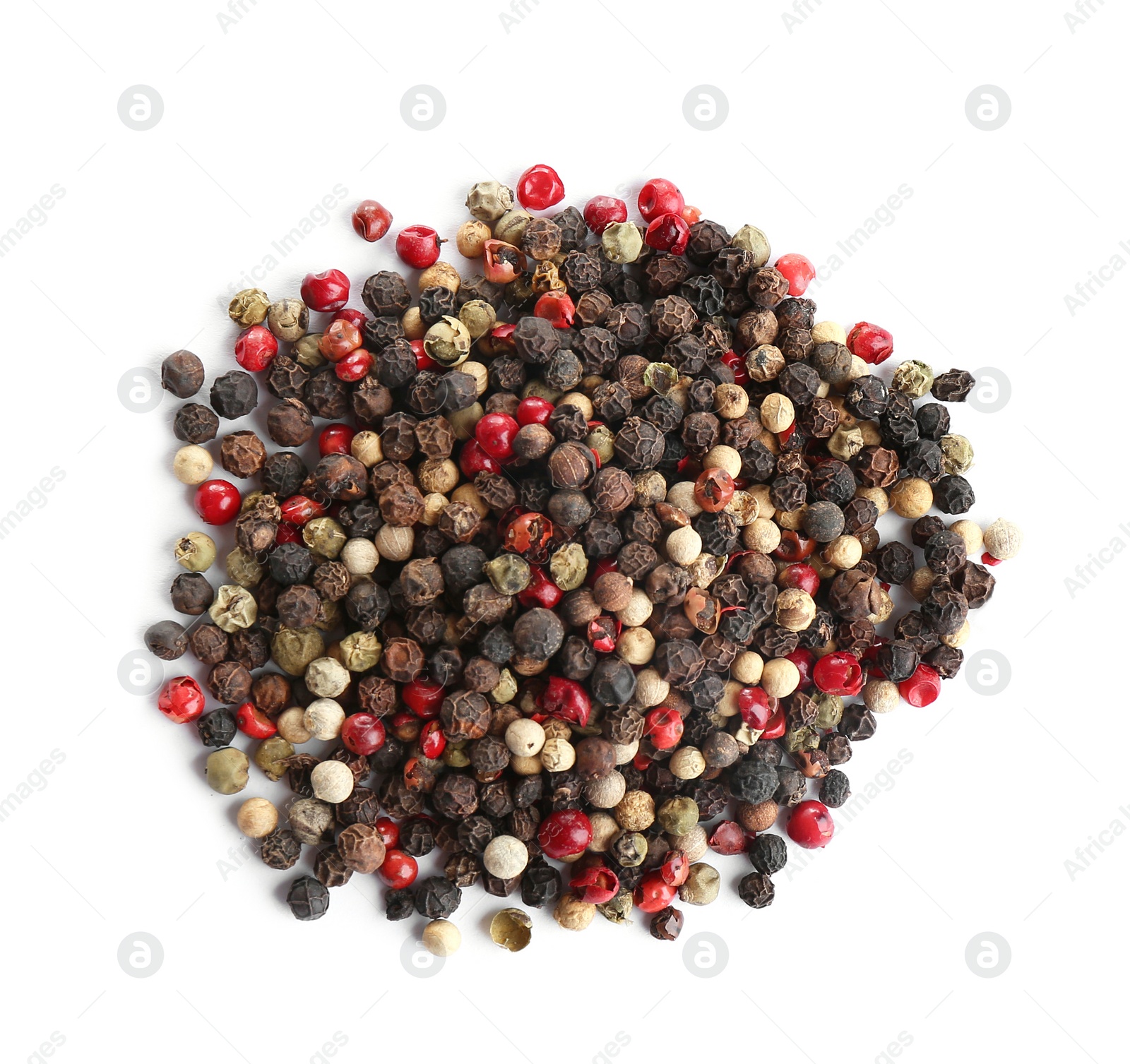 Photo of Heap of mixed peppercorns isolated on white, top view