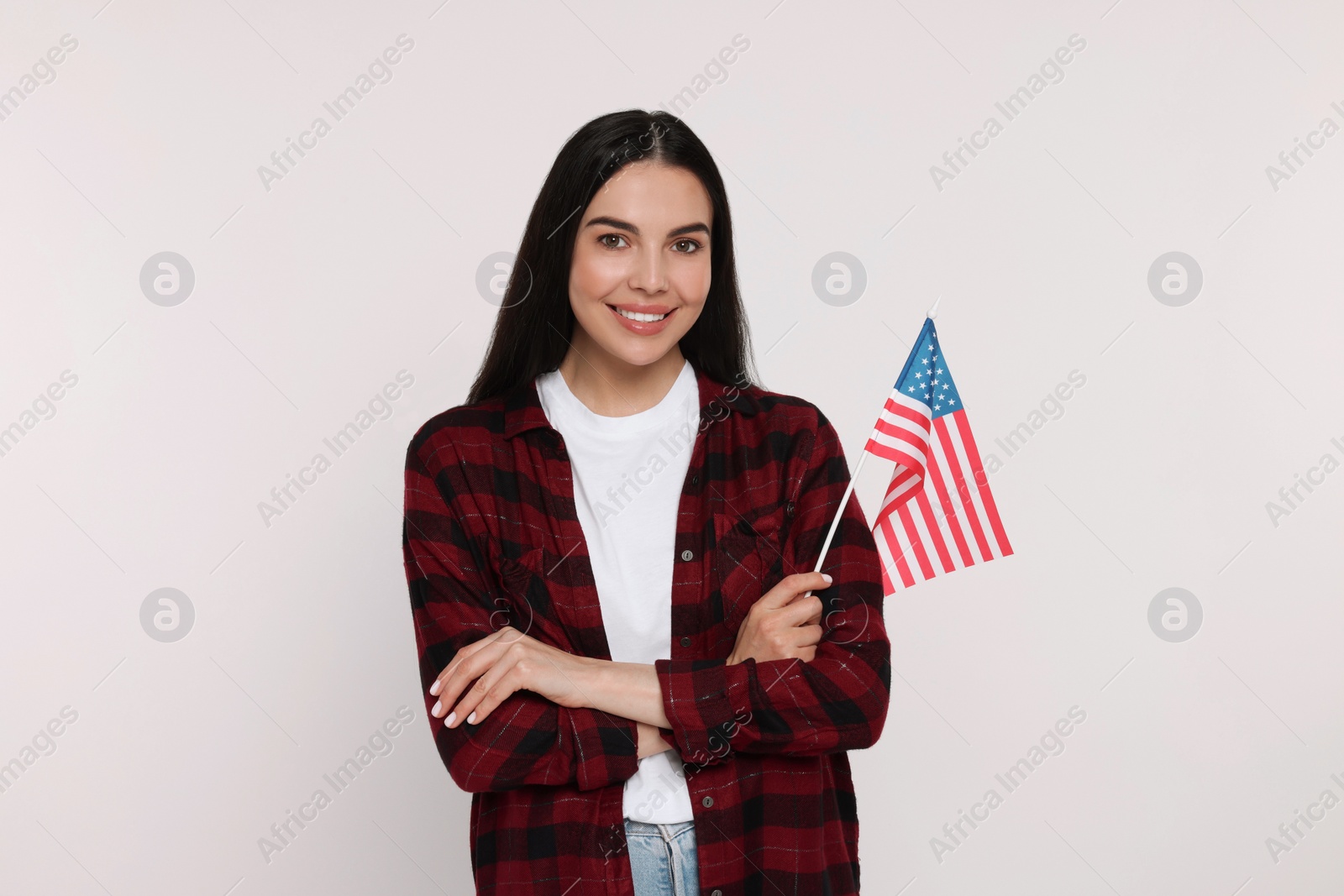 Photo of 4th of July - Independence Day of USA. Happy woman with American flag on white background