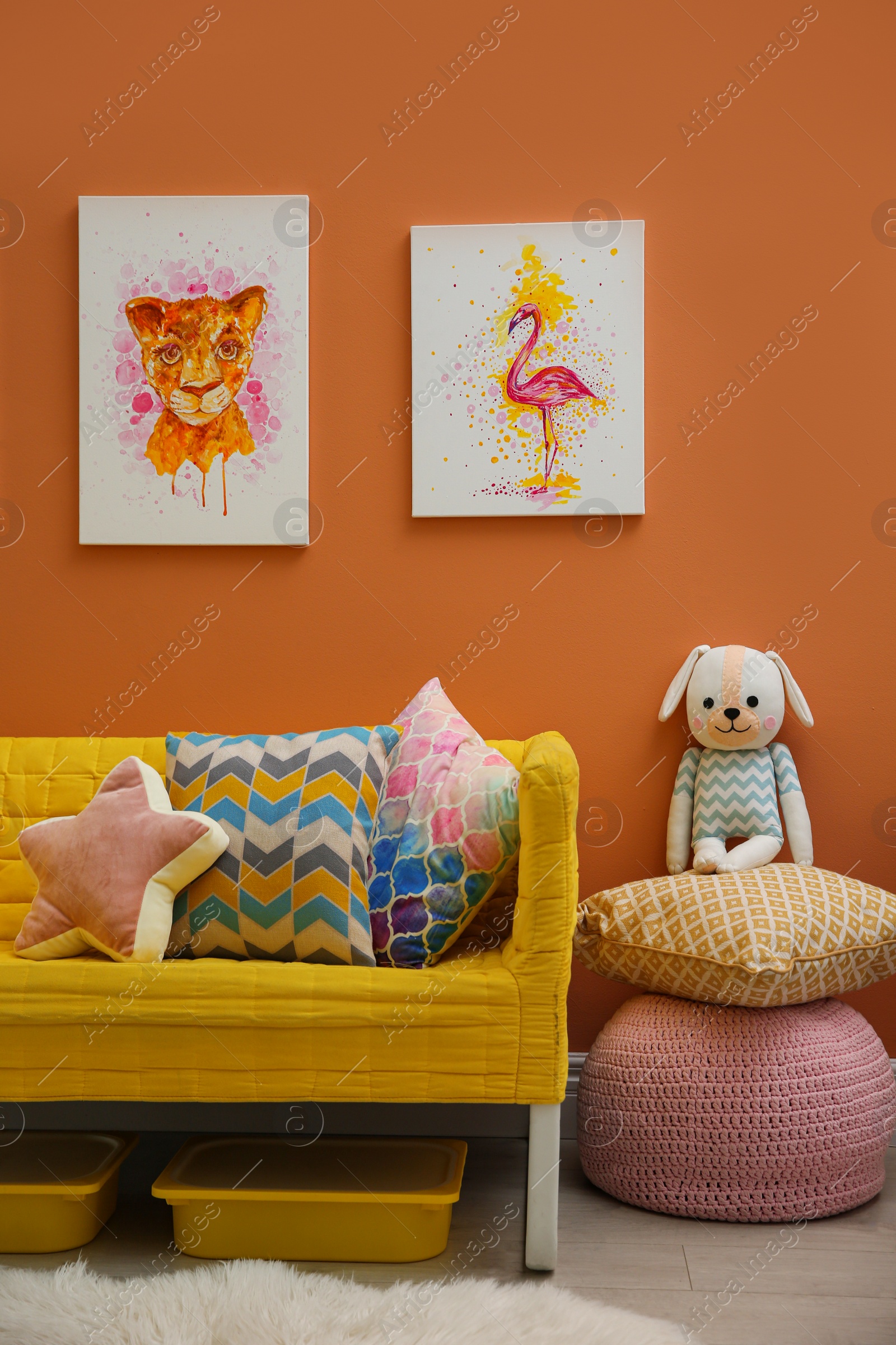 Photo of Cute pictures and comfortable sofa  in baby room interior